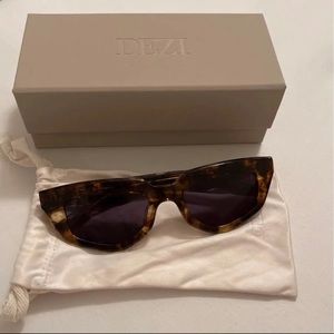 Dezi sunglasses on read dark roast dark smoke